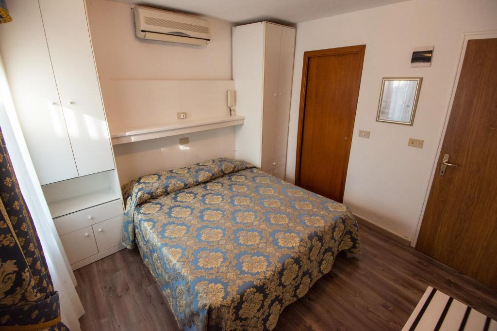 Postel nebo postele na pokoji v ubytování Albergo Casa Peron