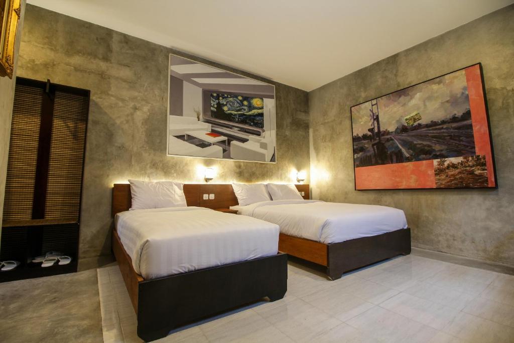 Postel nebo postele na pokoji v ubytování Watu Agung Guest House