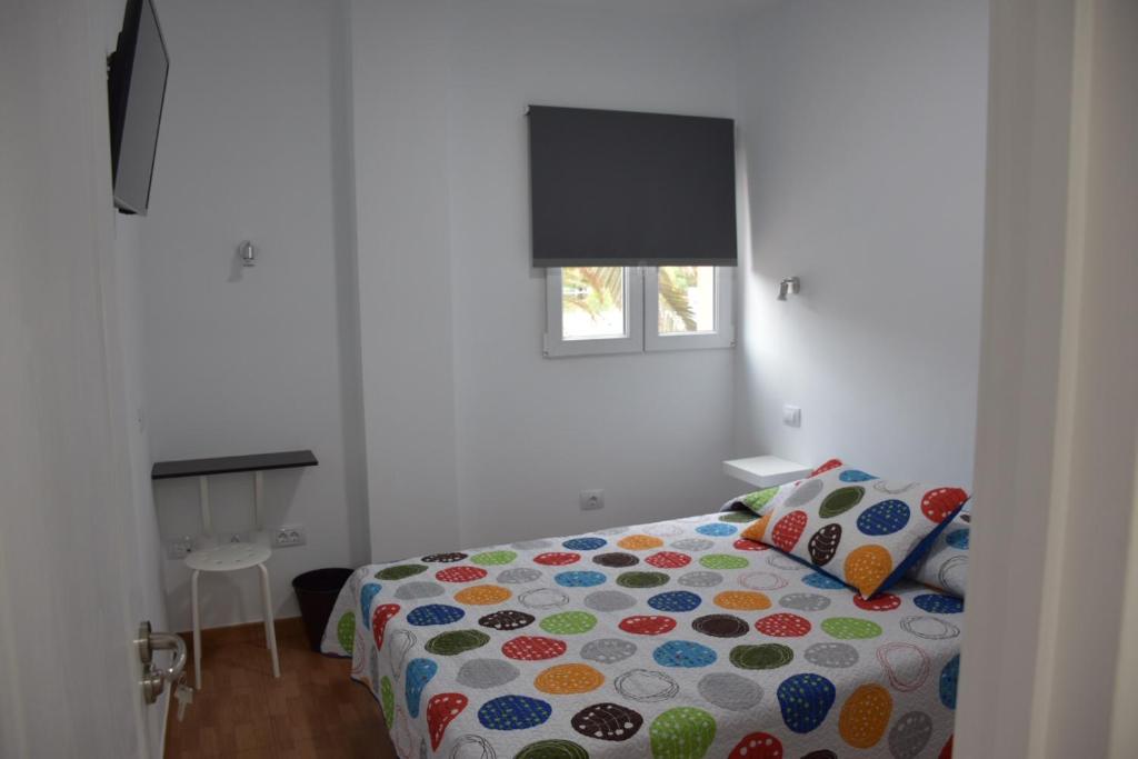 Posteľ alebo postele v izbe v ubytovaní Apartamento Quintana