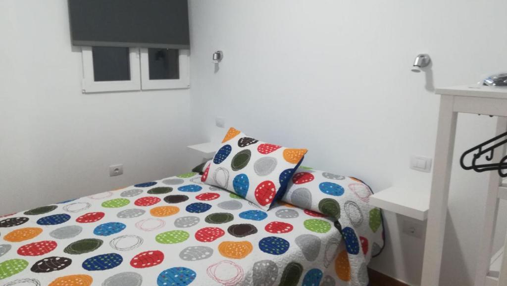 Posteľ alebo postele v izbe v ubytovaní Apartamento Quintana