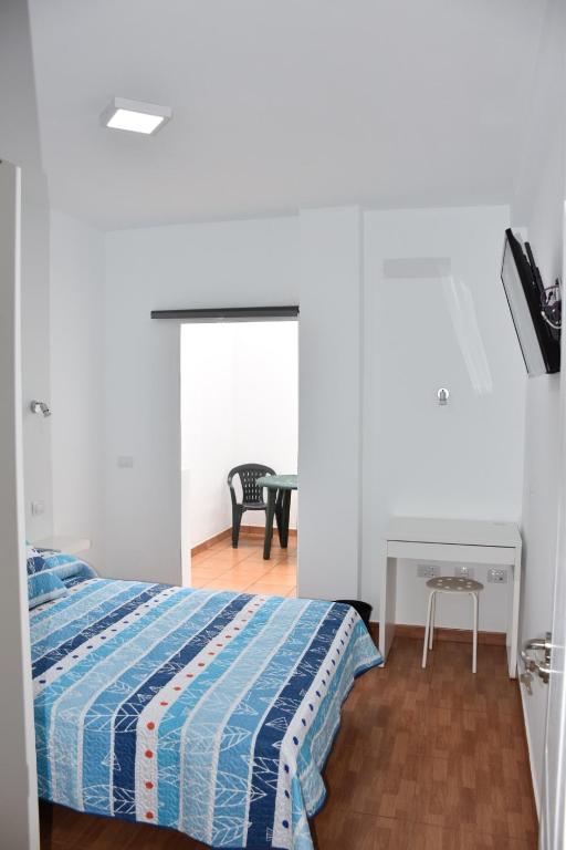 Posteľ alebo postele v izbe v ubytovaní Apartamento Quintana