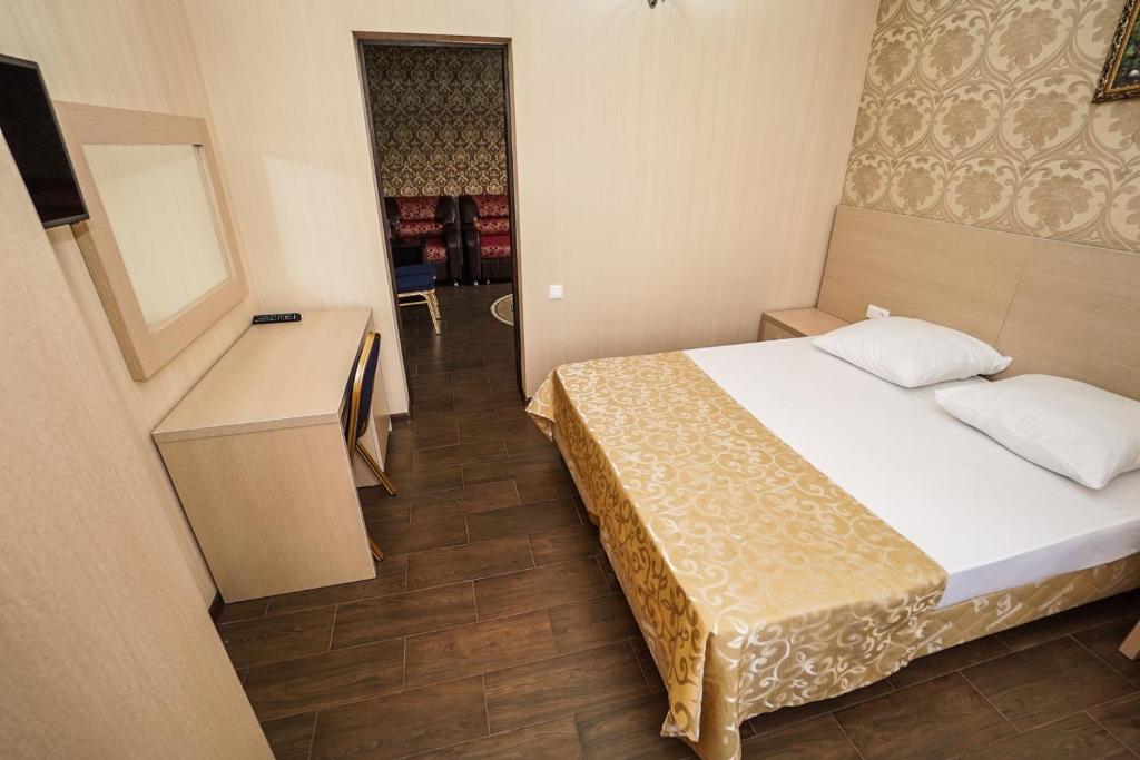 Postel nebo postele na pokoji v ubytování Antika Hotel