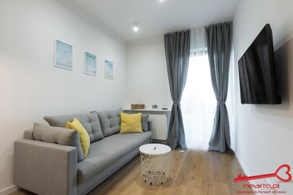 Televízia a/alebo spoločenská miestnosť v ubytovaní Apartments Nearto Old Town Rakowicka