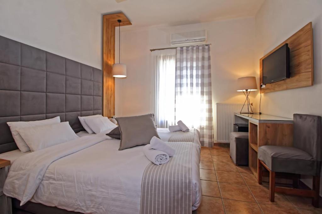Uma cama ou camas num quarto em Arion Hotel