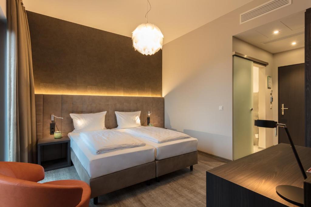 Postel nebo postele na pokoji v ubytování DECK 8 DESIGNHOTEL.SOEST