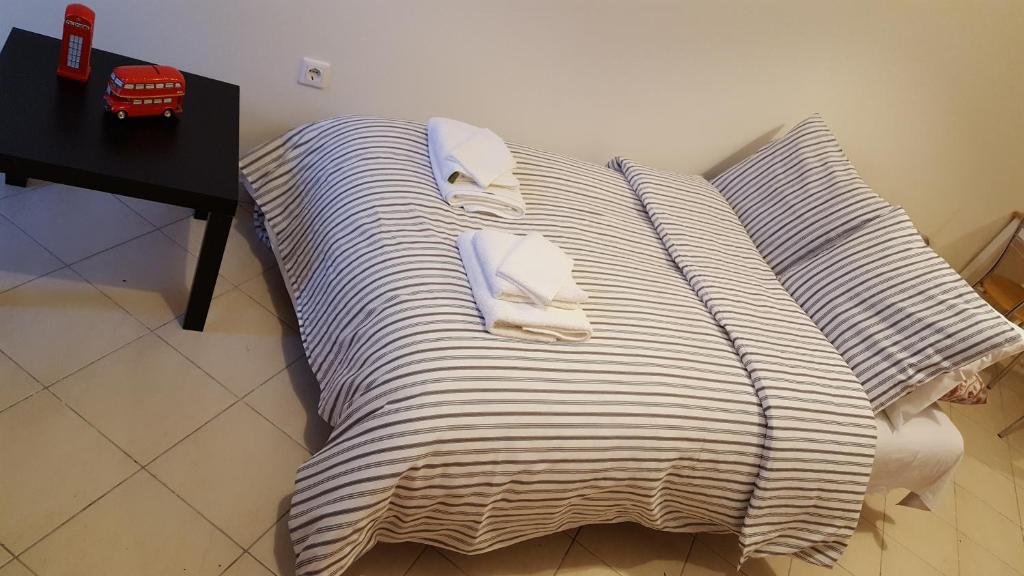 Postel nebo postele na pokoji v ubytování Patras Palm Tree