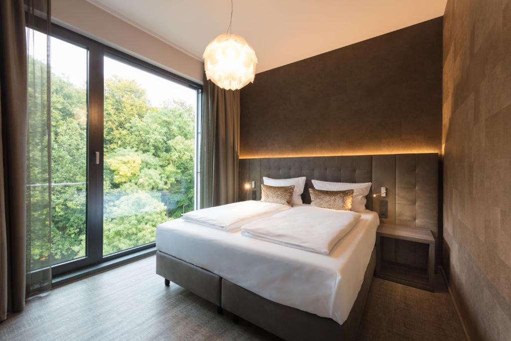 Postel nebo postele na pokoji v ubytování DECK 8 DESIGNHOTEL.SOEST