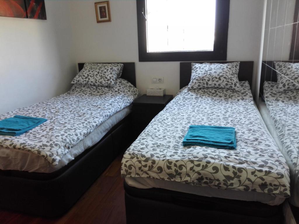 Posteľ alebo postele v izbe v ubytovaní Jie Apartment