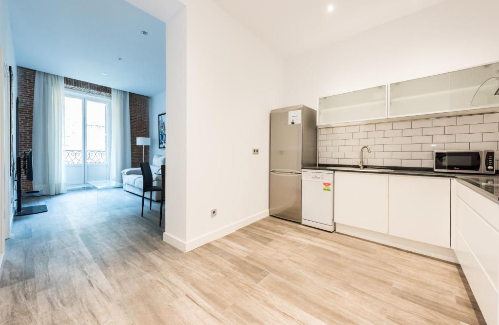 A kitchen or kitchenette at Puerta Del Sol City Center