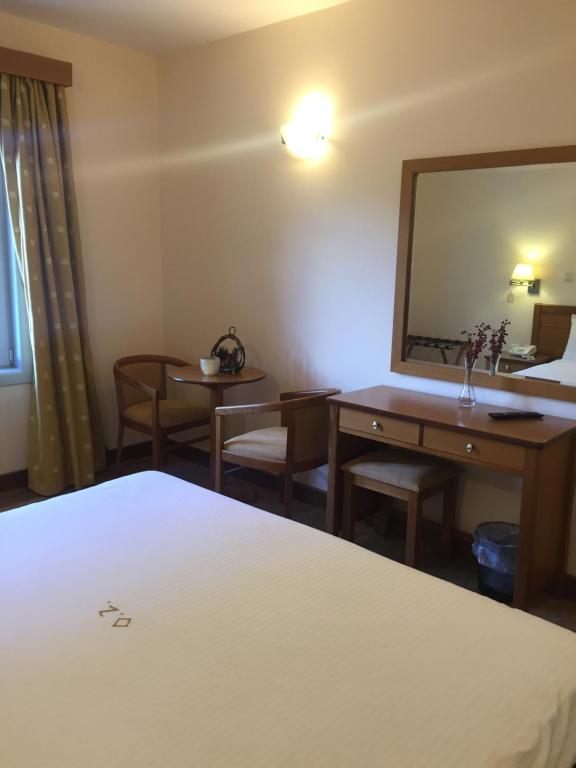 Posteľ alebo postele v izbe v ubytovaní Olympios Zeus Hotel