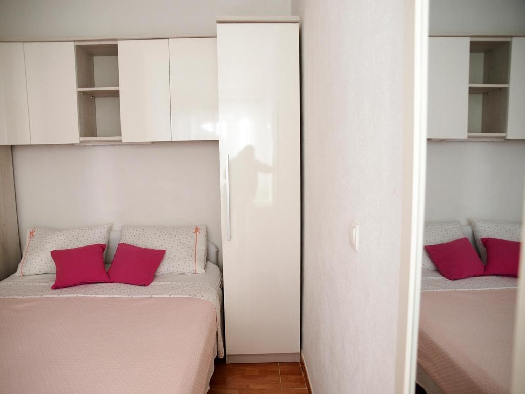 Postel nebo postele na pokoji v ubytování Apartments Tila