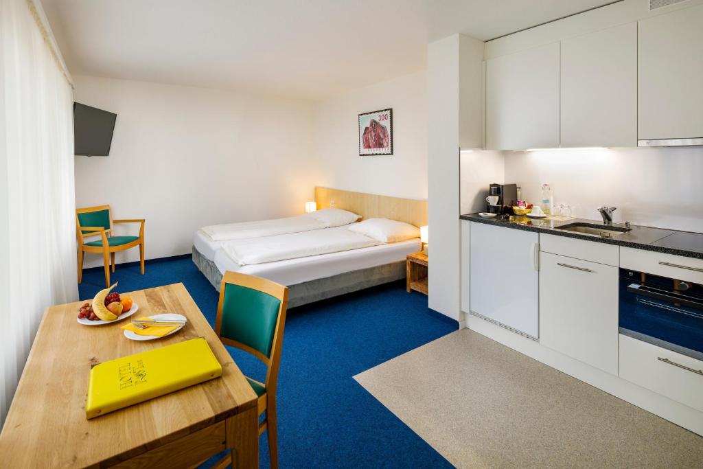 Kuchyň nebo kuchyňský kout v ubytování Central Hotel Post