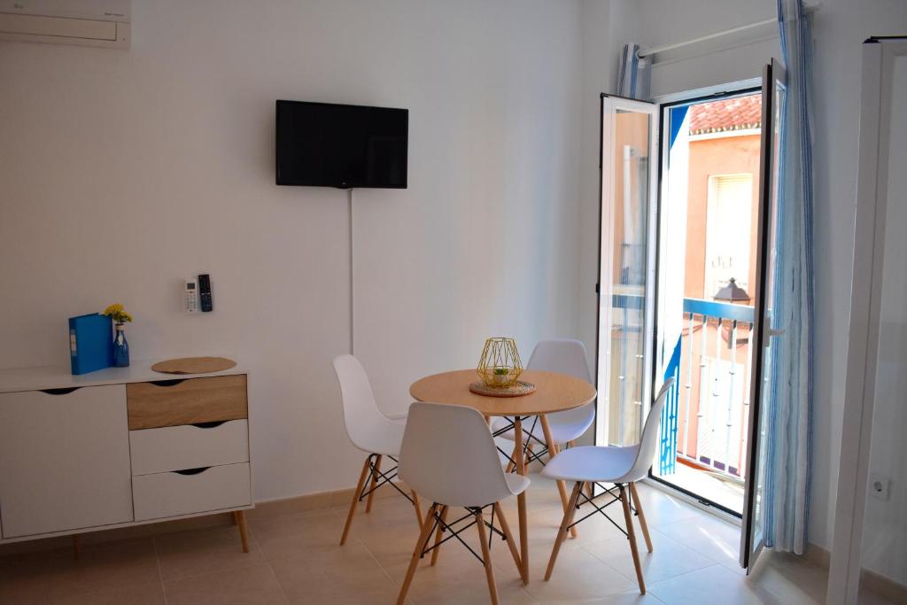 Televízia a/alebo spoločenská miestnosť v ubytovaní Casa Al Sur Apartments