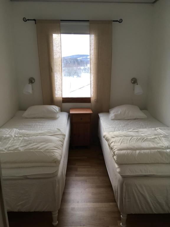 Кровать или кровати в номере Utsikten