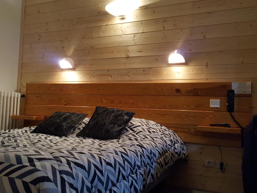 Postel nebo postele na pokoji v ubytování Hôtel Restaurant Glaizette