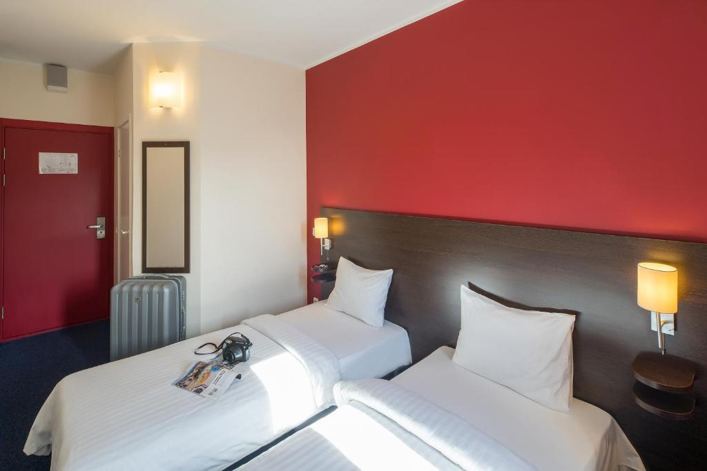 Gulta vai gultas numurā naktsmītnē Dodo Hotel