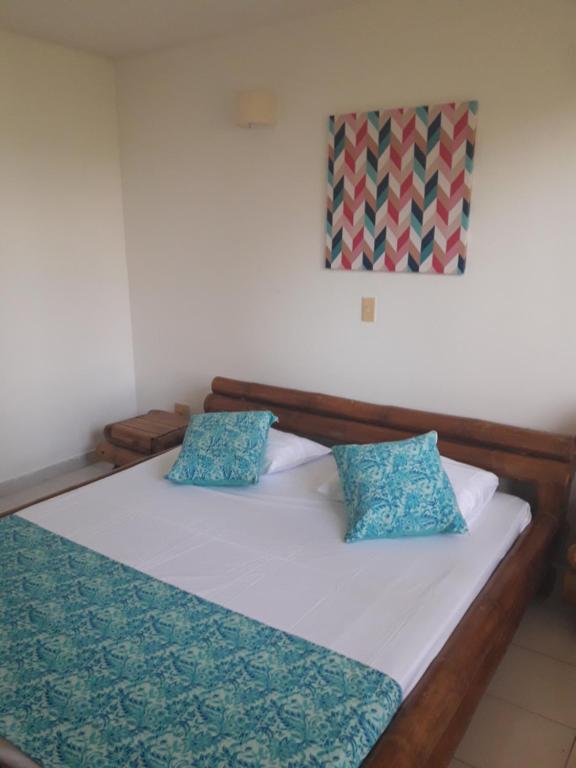 Postel nebo postele na pokoji v ubytování girardot resort apto102