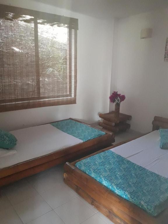 Postel nebo postele na pokoji v ubytování girardot resort apto102