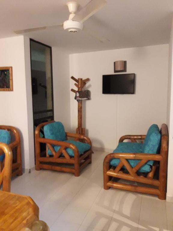 TV a/nebo společenská místnost v ubytování girardot resort apto102