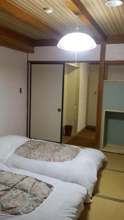 Postel nebo postele na pokoji v ubytování Hotel Weisser Hof Happei