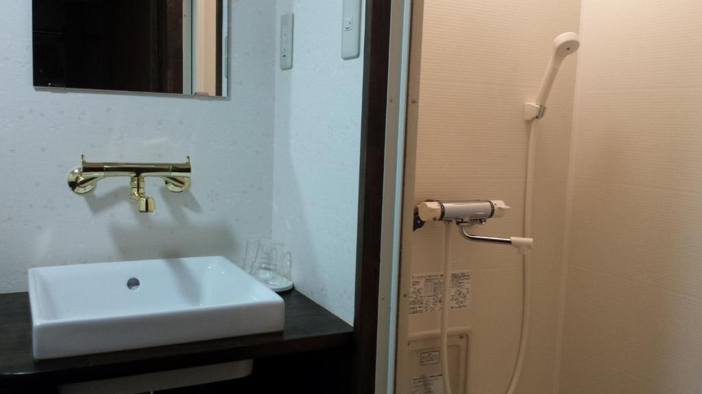 Koupelna v ubytování Hotel Weisser Hof Happei