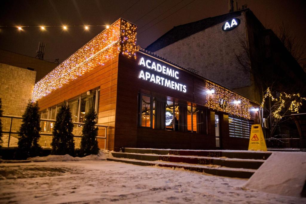 a building with christmas lights in front of it at Academic Apartments in Almaty