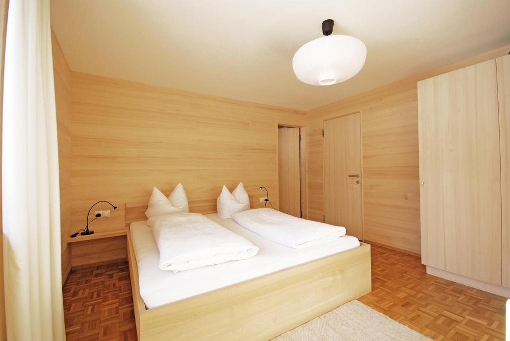 Postel nebo postele na pokoji v ubytování Gästehaus Meusburger