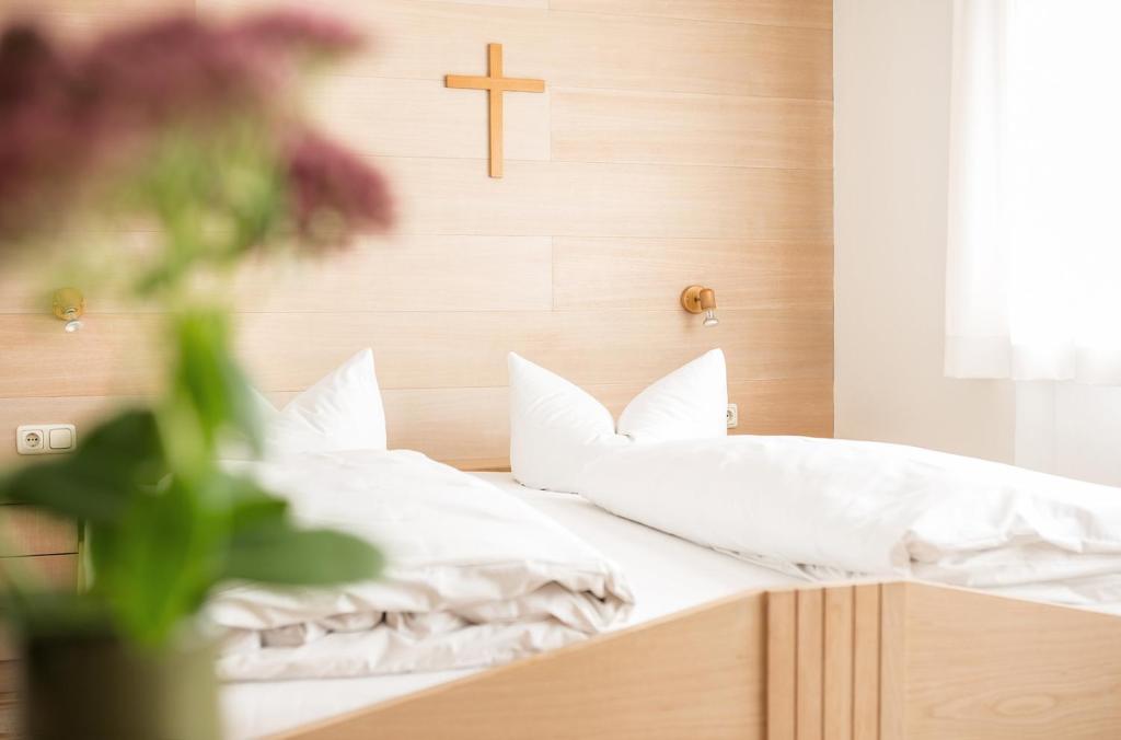 Postel nebo postele na pokoji v ubytování Gästehaus Meusburger