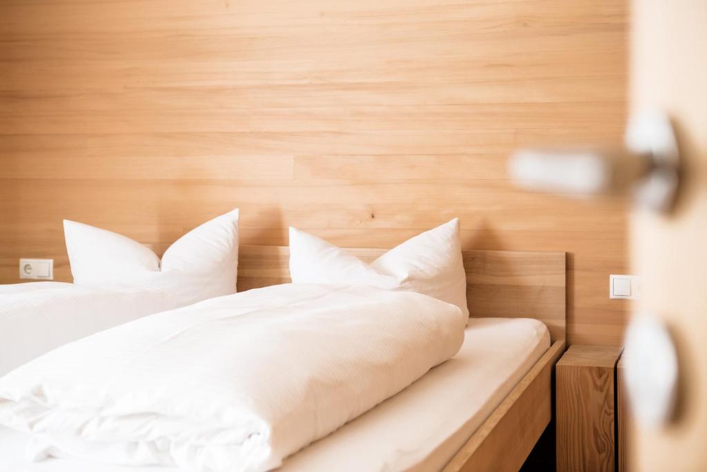 Postel nebo postele na pokoji v ubytování Gästehaus Meusburger