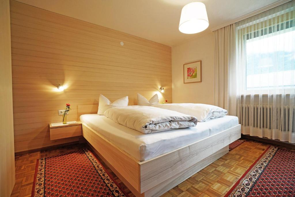 Postel nebo postele na pokoji v ubytování Gästehaus Meusburger