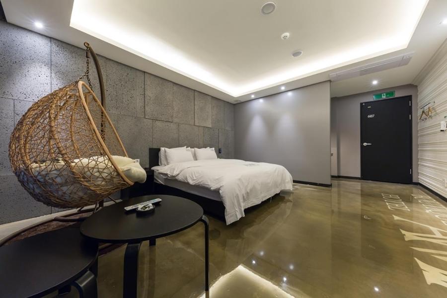 Postel nebo postele na pokoji v ubytování Anyang Boutique Hotel AMA