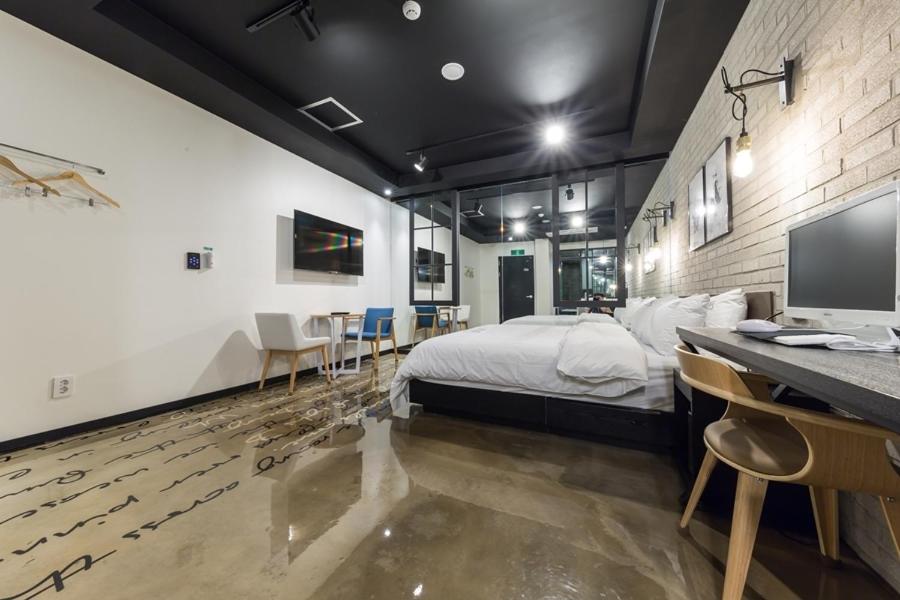 Postel nebo postele na pokoji v ubytování Anyang Boutique Hotel AMA