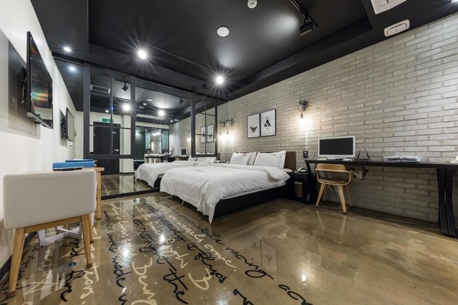 Postel nebo postele na pokoji v ubytování Anyang Boutique Hotel AMA