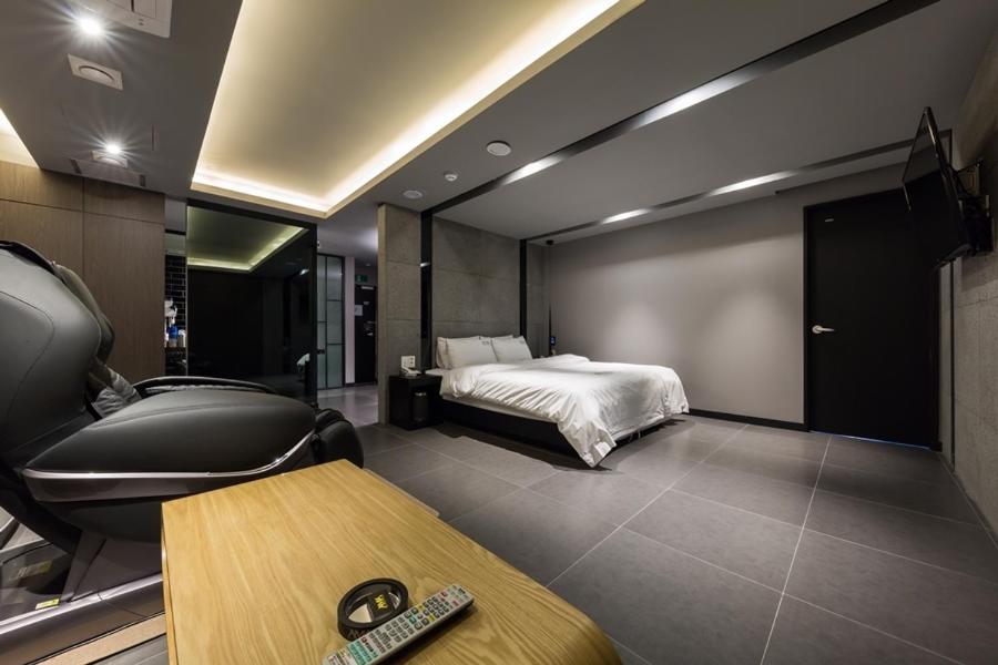 Postel nebo postele na pokoji v ubytování Anyang Boutique Hotel AMA