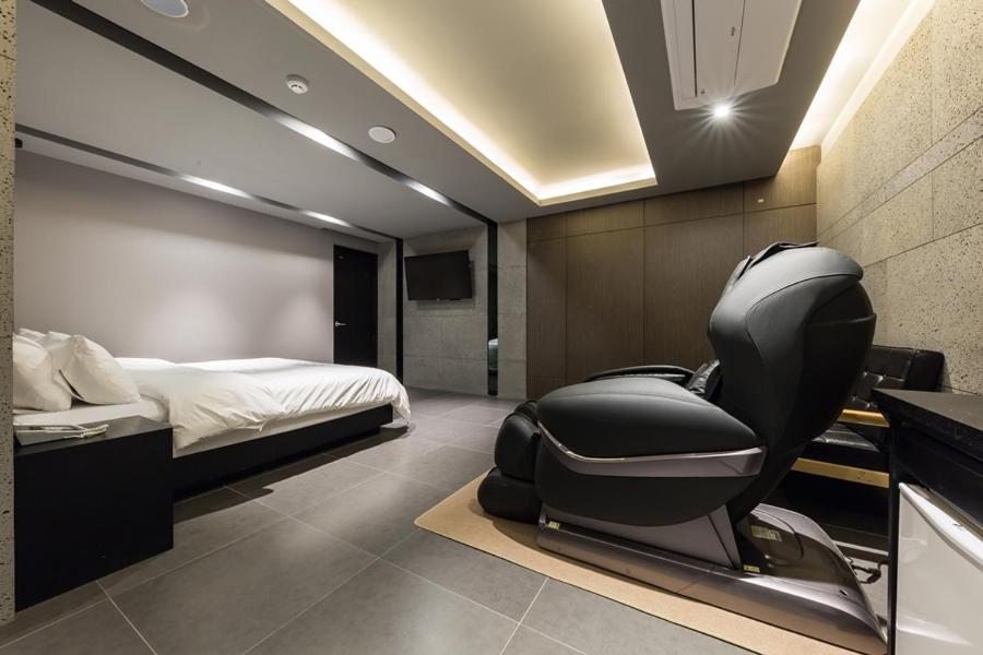 Postel nebo postele na pokoji v ubytování Anyang Boutique Hotel AMA