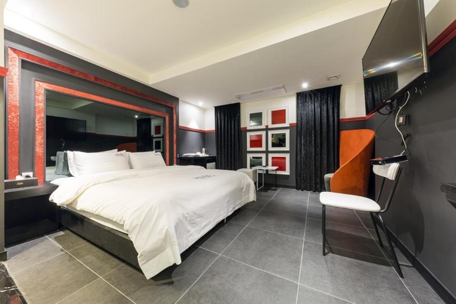 Postel nebo postele na pokoji v ubytování Anyang Boutique Hotel AMA