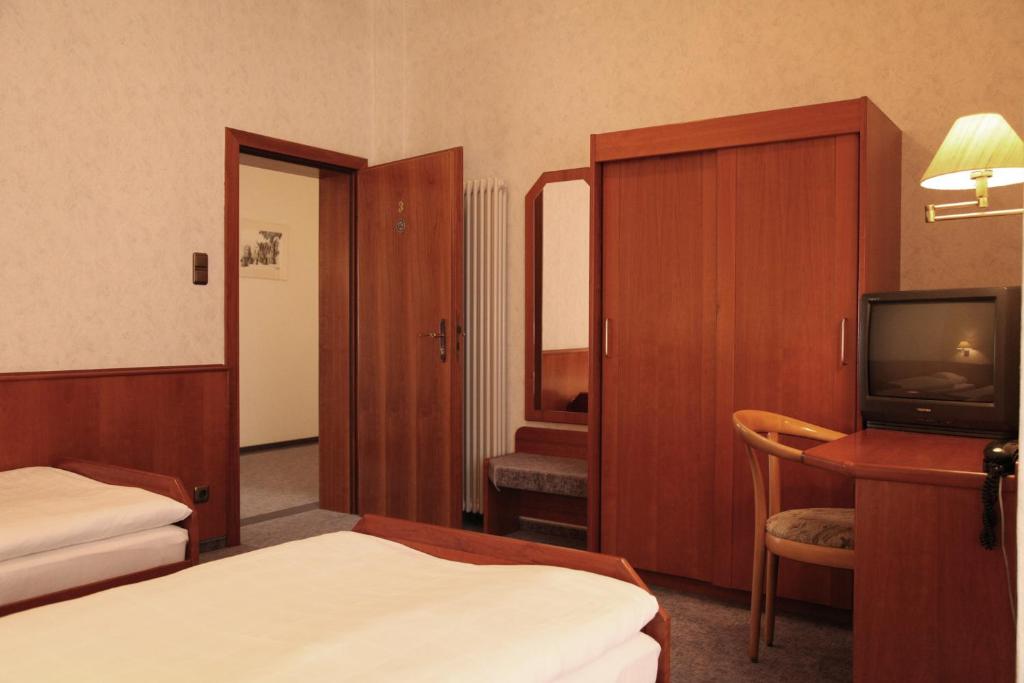 Postel nebo postele na pokoji v ubytování Ackfeld Hotel-Restaurant