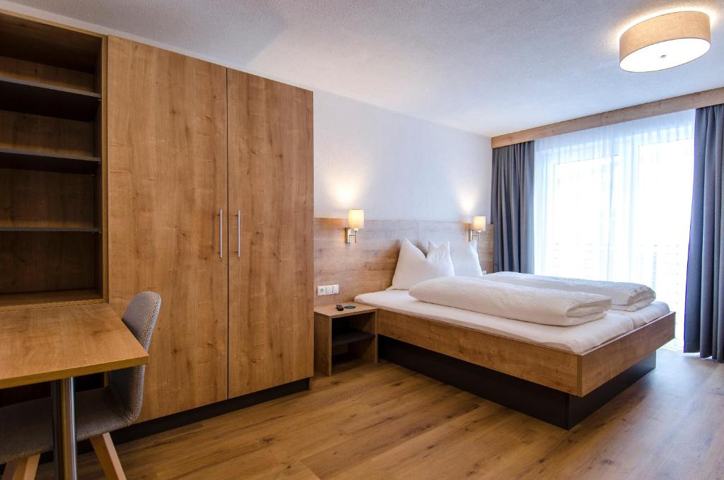 Posteľ alebo postele v izbe v ubytovaní St. Florian Appartements