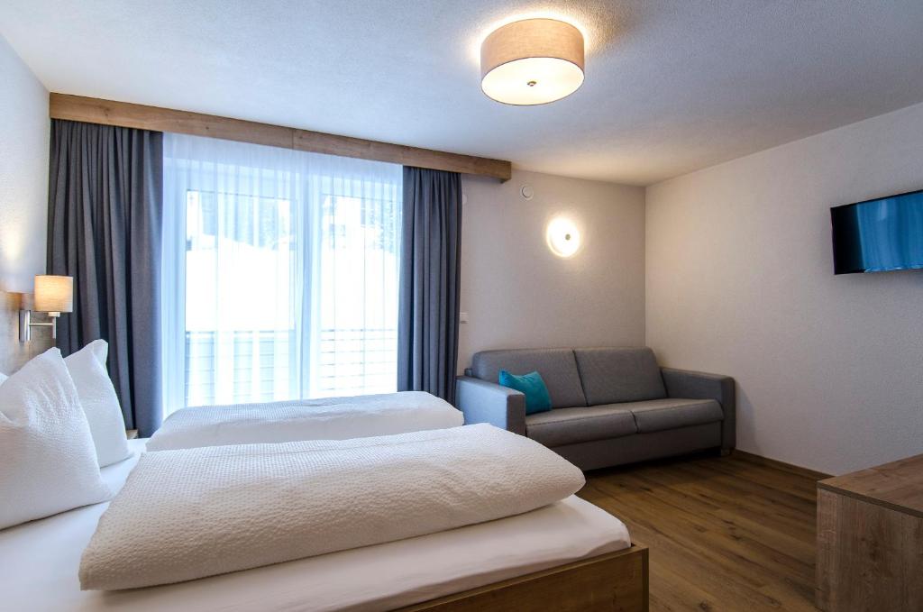 Posteľ alebo postele v izbe v ubytovaní St. Florian Appartements