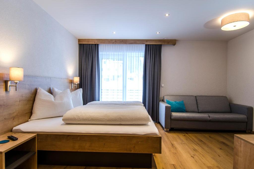 Posteľ alebo postele v izbe v ubytovaní St. Florian Appartements