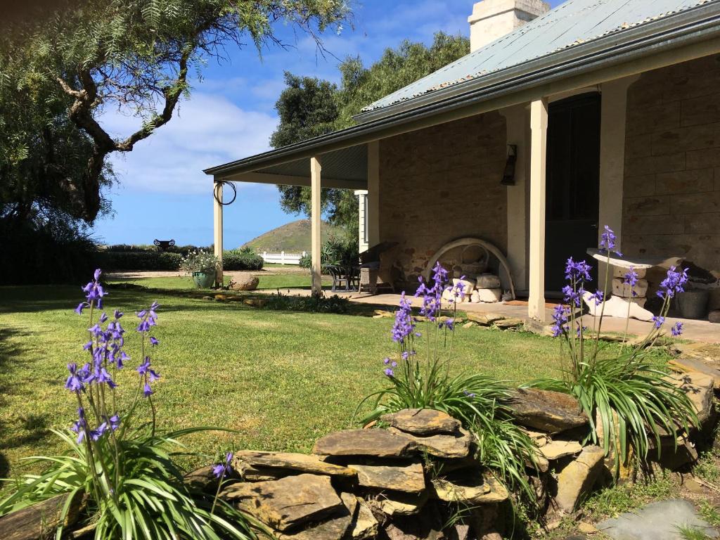 a house with purple flowers in the yard at Yelki by the Sea in Encounter Bay