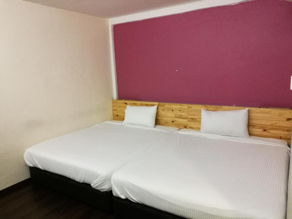 Postel nebo postele na pokoji v ubytování Dream Garden Hotel