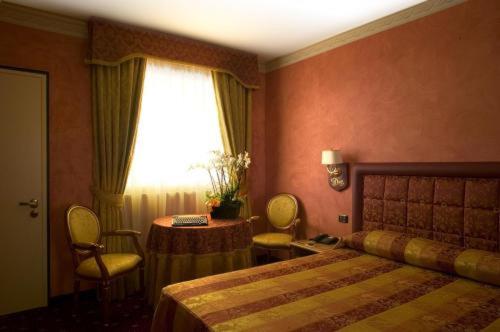 Postel nebo postele na pokoji v ubytování Hotel Motel Del Duca