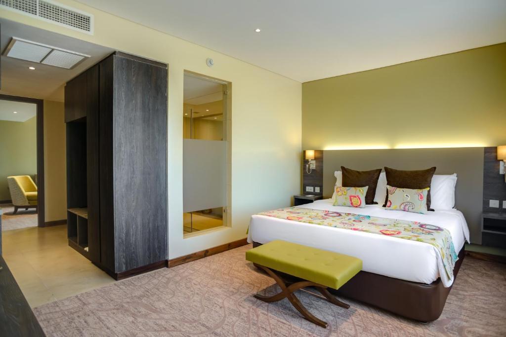 Postel nebo postele na pokoji v ubytování Tamarind Tree Hotel