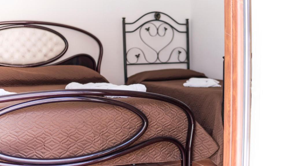 Postel nebo postele na pokoji v ubytování B&B Afrodite