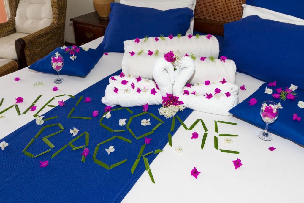Postel nebo postele na pokoji v ubytování Blue Haven Hotel - Bacolet Bay - Tobago