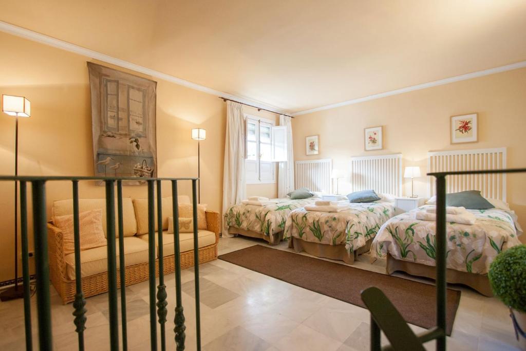 Łóżko lub łóżka w pokoju w obiekcie BOTANIC DUPLEX TERRACE 5 PAX