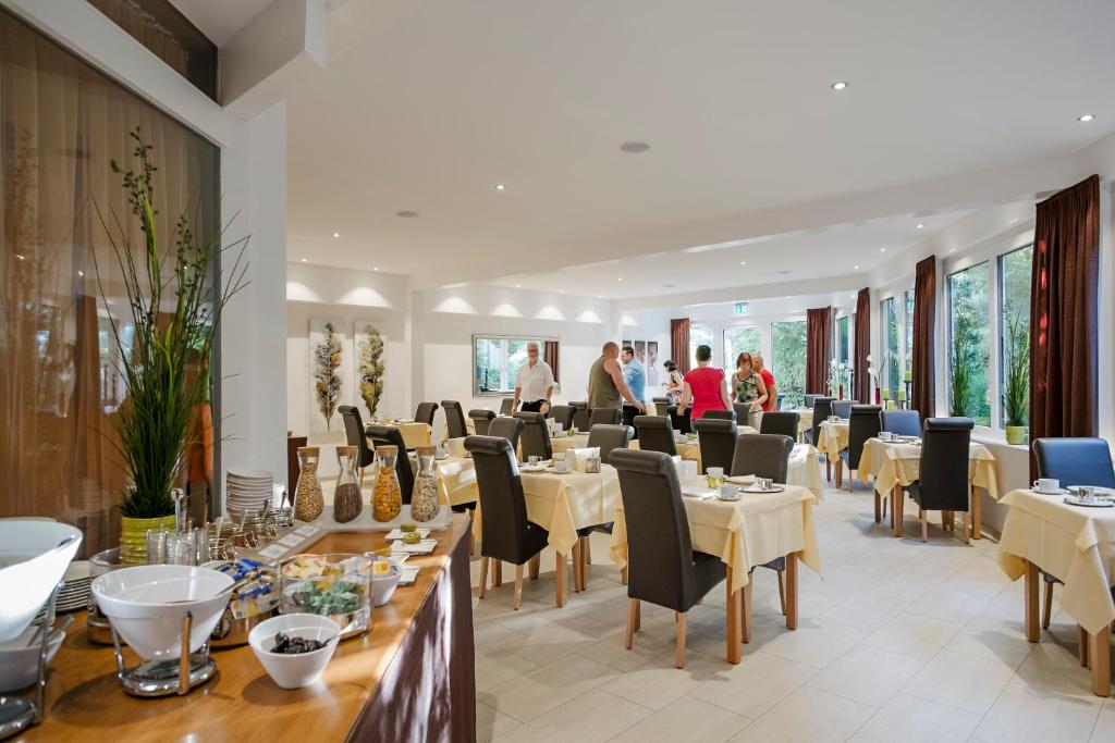 TV a/nebo společenská místnost v ubytování Hotel Nora