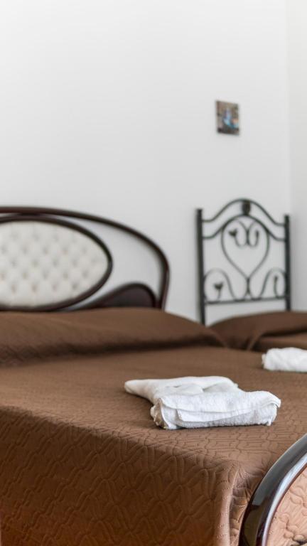 Postel nebo postele na pokoji v ubytování B&B Afrodite