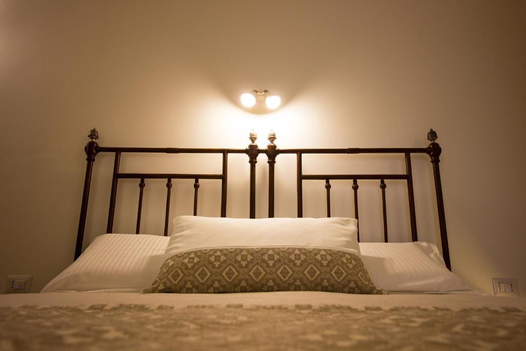 Postel nebo postele na pokoji v ubytování Ai Sottani B&B Deluxe Suite
